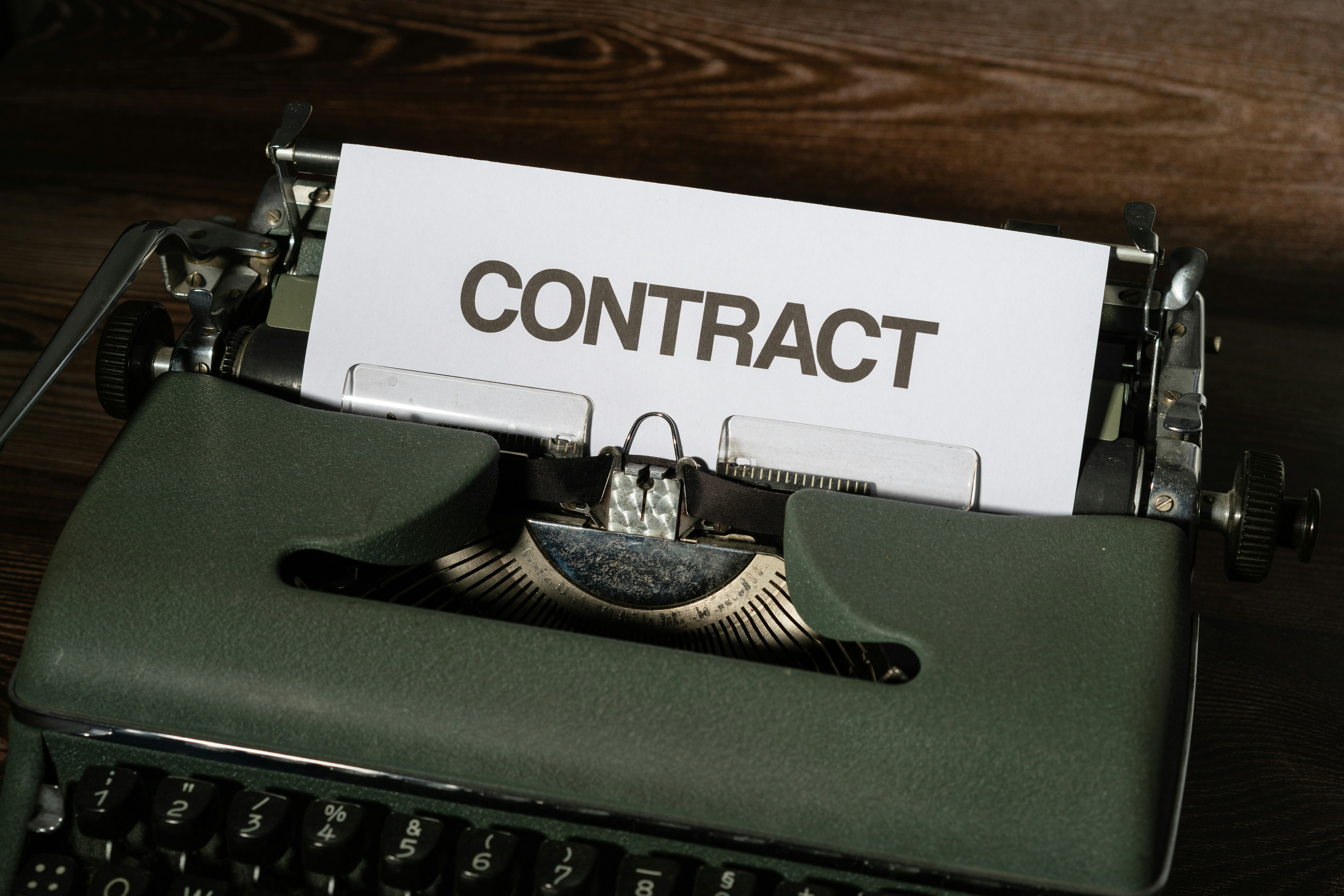 A contractor triaging a government RFP at their desk to reach a fast bid or no-bid decision